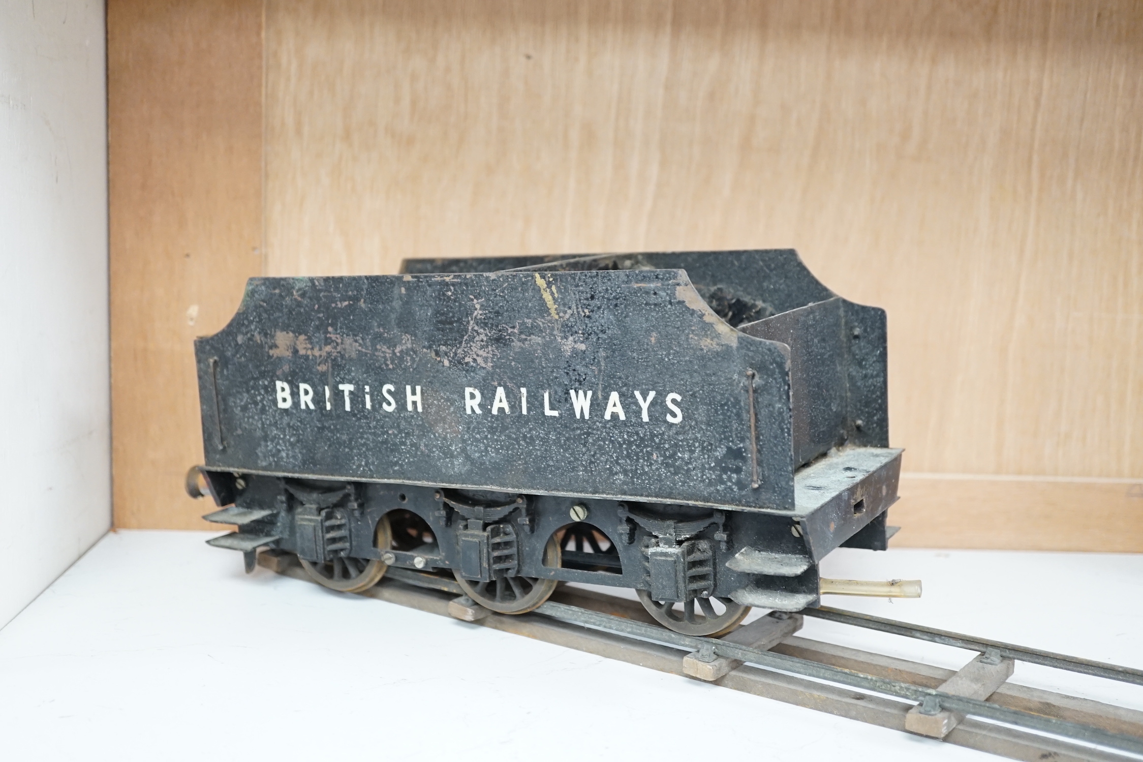 A paraffin/meths fired 2.5 inch live steam BR class 4F 0-6-0 tender locomotive, single inside cylinder, six wick burner, safety valve and whistle under running board, 72cm long over the buffers